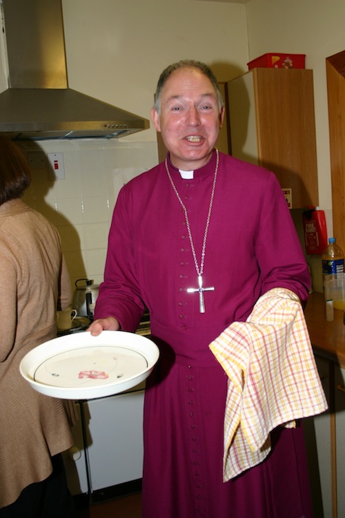Bishop Robert washing up at Holy Trinity in 2011
