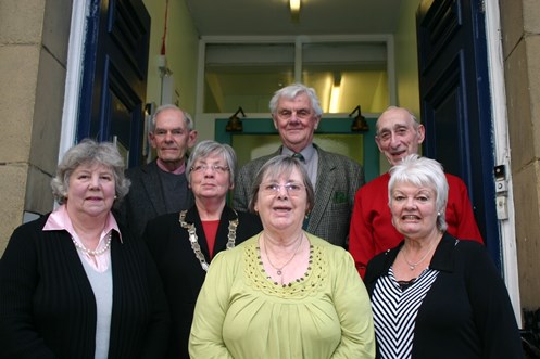 Former chair Anne Winter, wearing chain, with winners last year